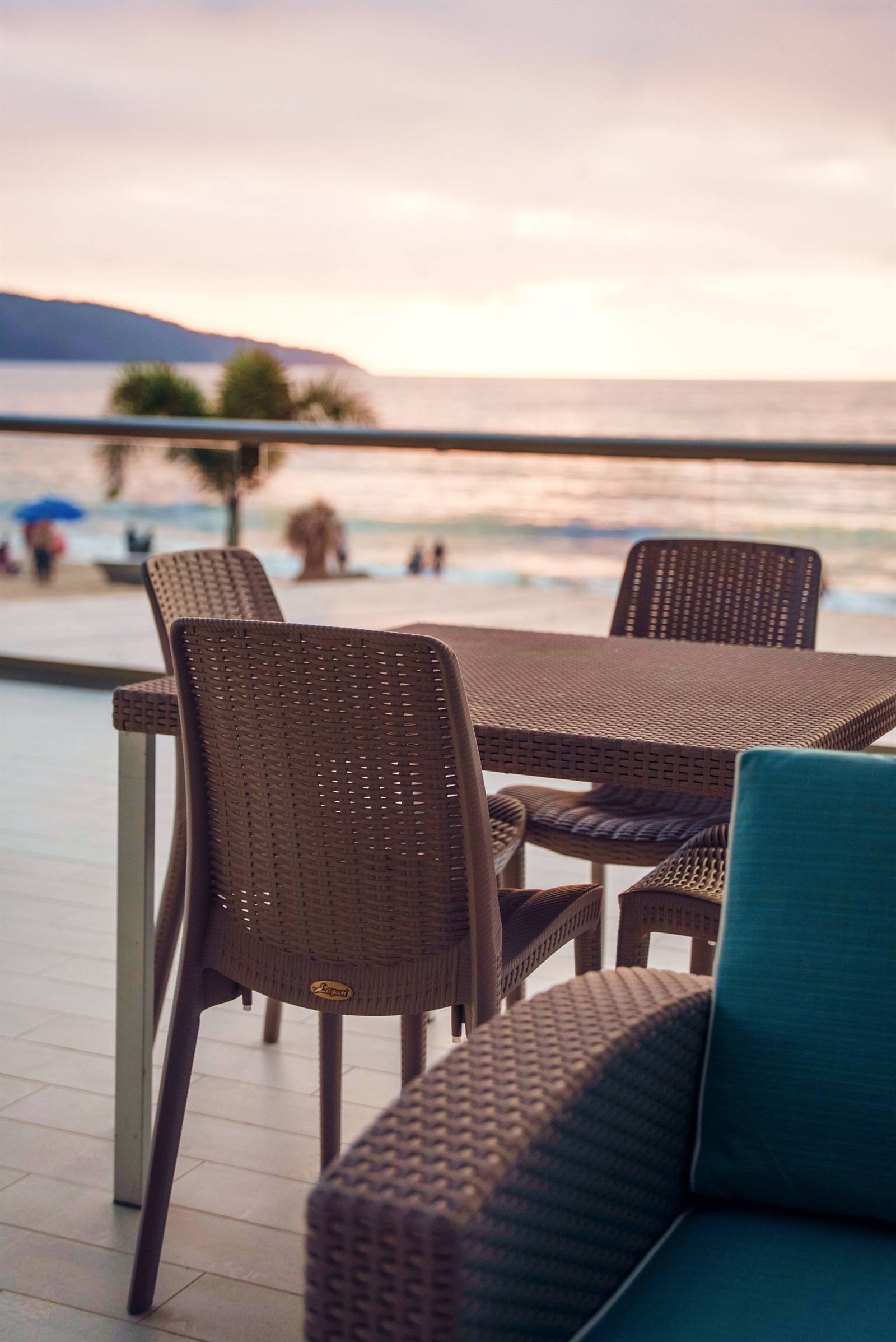 Avenir Armonia Suites: wicker table and chairs on a terrace facing the ocean and the beach